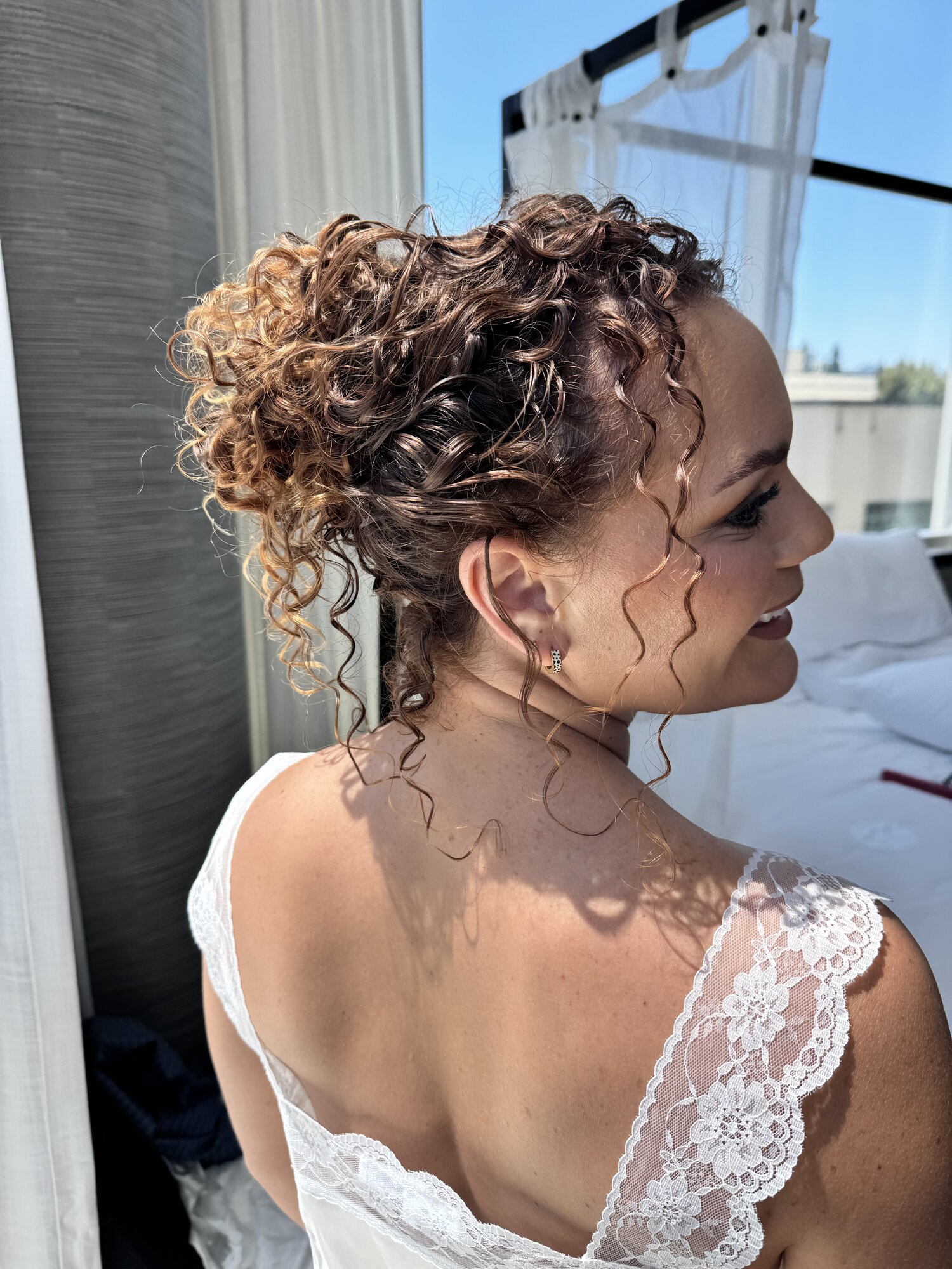 Curly bridal updo styled for an editorial shoot